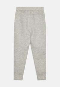 Gray sweatpants made of soft fabric, featuring a tapered design, elastic waistband, and ribbed cuffs at the ankles. No visible pockets.