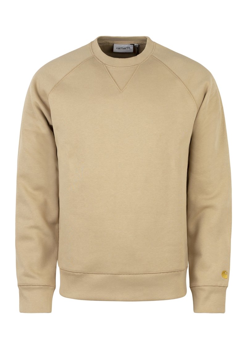Beige bavlněná mikina s kulatým výstřihem, žebrovanými manžetami a malou nášivkou loga na levém rukávu. Má hladkou texturu a minimalistický design.
