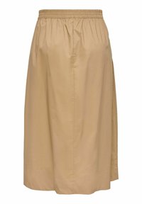 Jupe beige longueur genou avec taille élastique et fente latérale, en tissu lisse et léger.