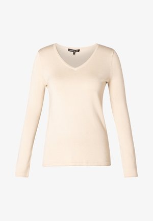 Langärmliges, v-ausschnitt Top in hellbeige mit glatter Textur und schlichter Gestaltung. Hergestellt aus bequemem, leichtem Stoff.
