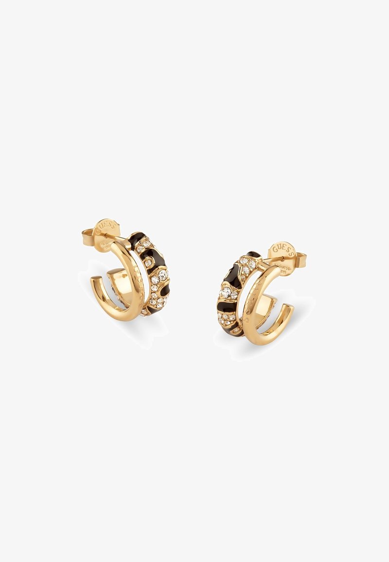Boucles d'oreilles en or en forme de anneau avec des accents noirs, ornées de strass clairs incrustés le long du bord et d'un fermoir sécurisé.