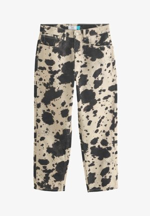 Straight-leg jeans in beige denim featuring a black splatter pattern. Four pockets and contrasting stitching detail.