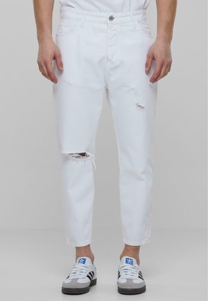 Sirgete säärtega teksad - white