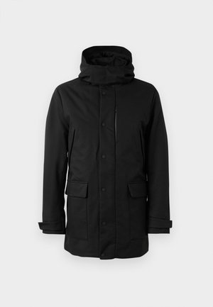 Mustapintainen vedenpitävä takki, jossa on korkea kaulus, napit, kaksi etutaskua ja säädettävät hihansuut. Sileä pinta, pitkähihainen muotoilu.