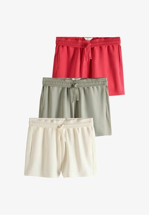 Drei Paar Shorts mit elastischem Bund und Kordelzug in Rot, Hellgrün und Off-White, vertikal auf einem weißen Hintergrund gestapelt.