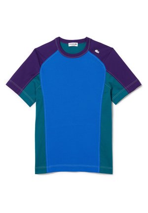 T-shirt à manches courtes à blocs de couleurs bleu, violet et vert avec surpiqûres contrastées et logo Lacoste en haut à gauche. Tissu en mélange de coton.