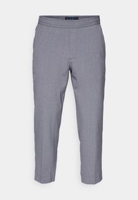 Grijze broek met een gestructureerde stof, elastische tailleband en taps toelopend ontwerp. Heeft een subtiel ruitpatroon en een cropped lengte.