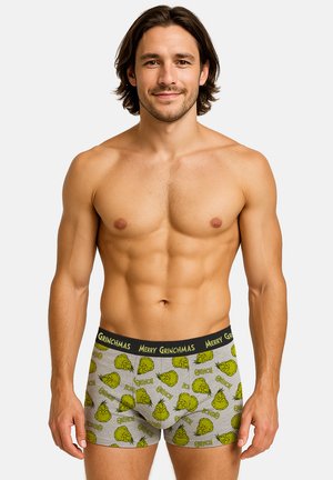 Grey boxer briefs featuring a green Grinch pattern, elastic black waistband with "MERRY GRINCHMAS" text, and a fitted design.