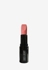 Rossetto in un tubo nero con finitura opaca. Il bullet è di una delicata tonalità rosa con una parte superiore piatta e un marchio in rilievo.