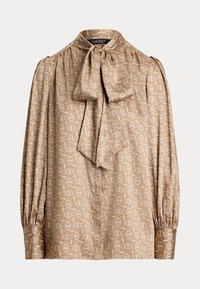 Blusa beige con collo alto e fiocco. Presenta un motivo geometrico in oro e crema, maniche lunghe con polsini arricciati, texture setosa.