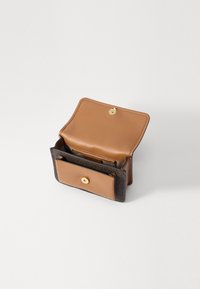 Brown and black wallet with a textured exterior, smooth interior, gold button closure, and multiple card slots. Opened for visibility.