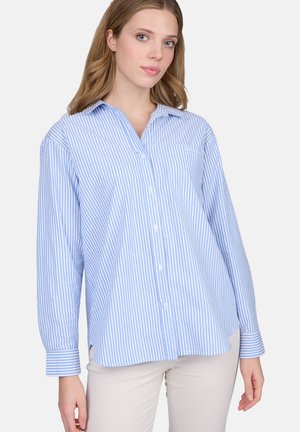 Chemise boutonnée à rayures bleues claires et blanches, avec col, manches longues, poche poitrine et coupe décontractée. Fabriquée dans un tissu doux.