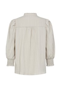 Lange mouwen, lichtbeige blouse met textuur, met een gerimpelde halslijn, geplooide achterkant en verzamelde manchetten met elastische details.
