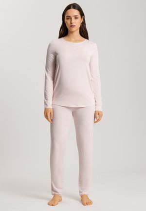 Light pink long-sleeve top and matching pants, made from soft fabric, featuring a relaxed fit and subtle texture. No visible patterns or hardware.