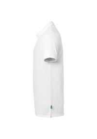 Witte polo met korte mouwen en kraag, zichtbaar "uhlsport" logo op de mouw en een klein groen label bij de zoom, weergegeven vanuit de zijkant.