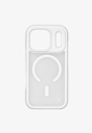 White transparent phone case with large camera cutout and circular MagSafe charger alignment design, branded "iDeal of Sweden" in corner.