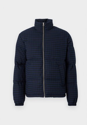 Navy blue puffer jacket with a checkered pattern, high collar, front zipper, and side pockets. The design features a textured finish.