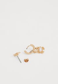 Gold-tone earrings featuring a twisted hoop design, a pearl accent, and a textured post earring. Includes a butterfly back closure.