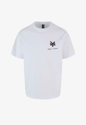 Maglietta bianca a maniche corte in cotone con scollo rotondo. Presenta un logo nero di Zoo York sulla parte sinistra del petto.