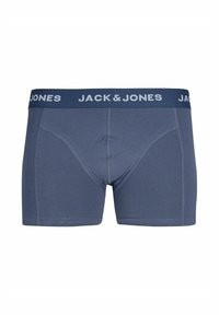 Moške boksarice v temno modri tkanini z mehkimi pasovi, ki nosijo bel logo "JACK & JONES". Gladka tekstura in prilegajoča zasnova.