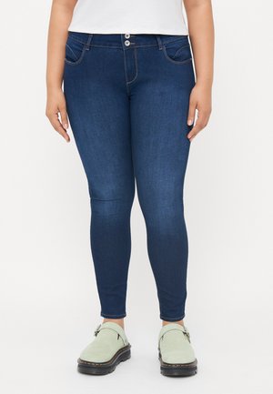 Dark blue denim skinny jeans with a smooth texture, featuring two front pockets, subtle stitching, and a double button closure.