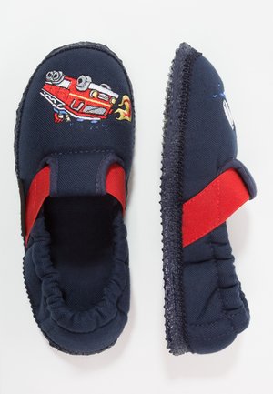 Navy blue slippers with red accents, fabric upper featuring an embroidered red fire truck design, and a textured rubber sole for grip.