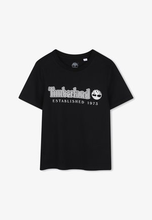 T-shirt noir en coton à manches courtes, avec texte imprimé blanc « Timberland » et « Established 1973 », accompagné d'un logo.