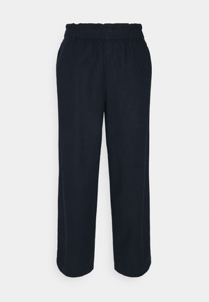 Pantalon à jambe droite avec taille élastique noire et poches latérales, présenté sur un fond clair uni.