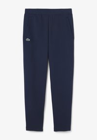 Navy blue sweatpants with elastic waistband, side pockets, and a small crocodile logo on the left thigh.