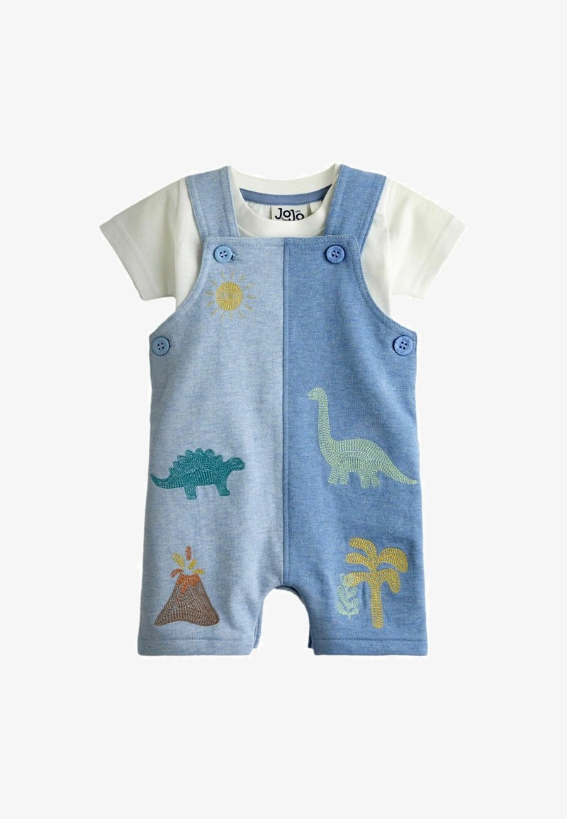 Combinaison bébé avec salopette bleue brodée de dinosaure, volcan, palmier et soleil sur une chemise blanche à manches courtes.