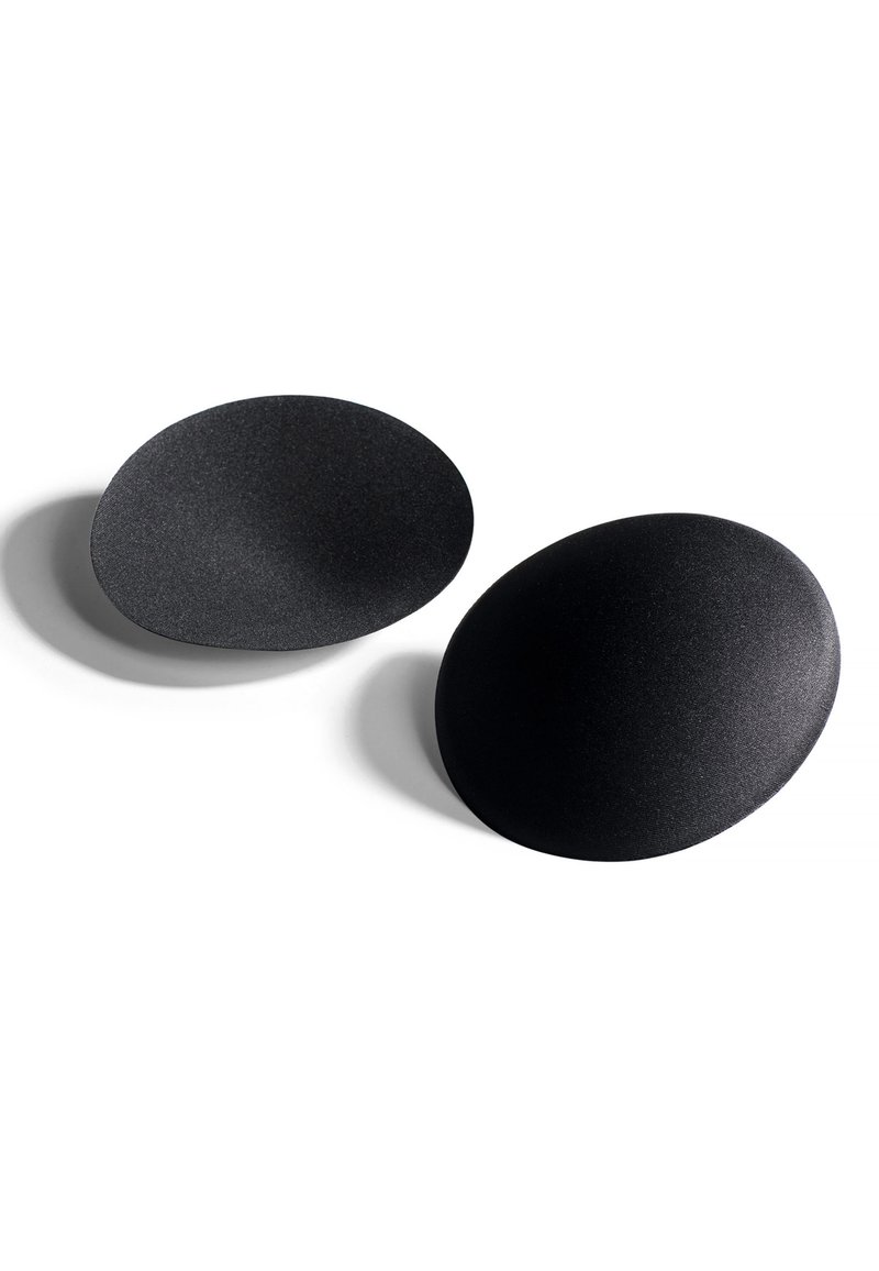 Czarne, owalne obiekty o matowym wykończeniu i gładkiej fakturze, z subtelnymi różnicami w głębokości powierzchni.