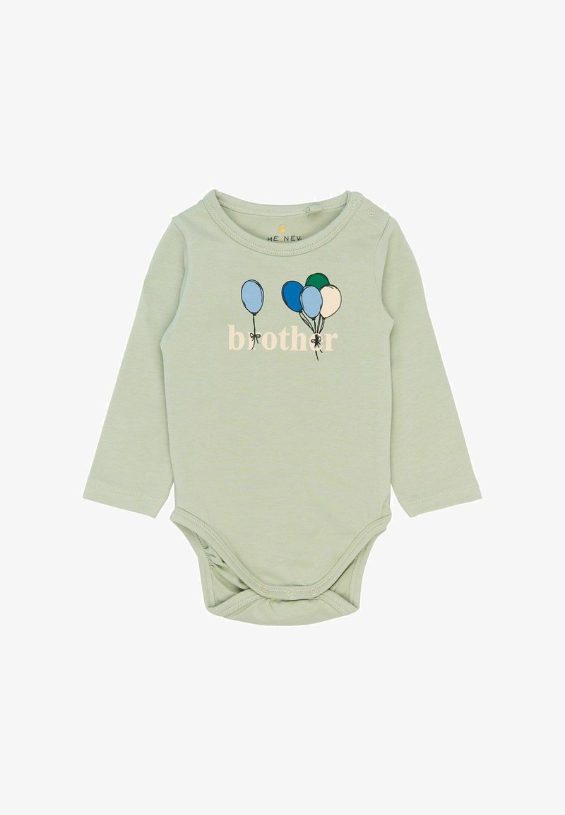 Bodysuit en coton vert à manches longues avec un imprimé "frère" et des graphismes de ballons colorés. Fermeture à pression à l'entrejambe pour un habillage facile.