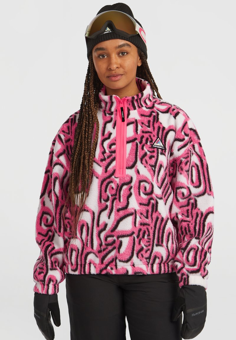 Fleece pullover featuring a pink and white abstract pattern, with a high collar, half-zip closure, and black accents. Black gloves included.