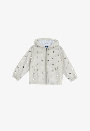 Chaqueta impermeable gris claro con capucha, decorada con patrones florales metálicos, puños elásticos y cremallera frontal. Incluye dos bolsillos laterales.