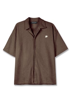 Brown short-sleeve button-up shirt with a textured fabric and a left chest logo. Features a classic collar and a relaxed fit.