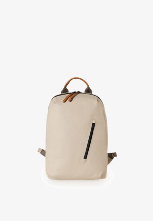 Beige backpack made of durable material, featuring a black front zipper, brown leather accents on the top, and adjustable straps.