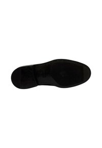 Suola di scarpa in pelle nera con una superficie liscia e texture. Presenta cuciture lungo i bordi e un piccolo pezzo rettangolare di gomma.