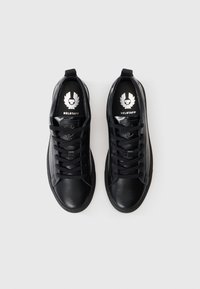 Black leather sneakers with rounded toes. Features include black laces, logo on the tongue, and a smooth texture. No additional accents.