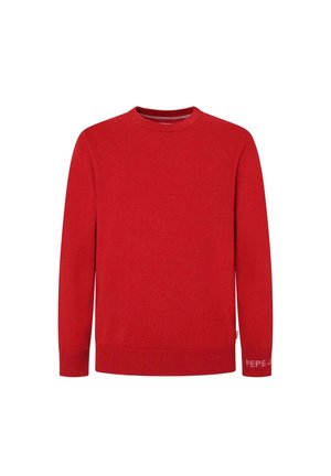 Maglione rosso a maglia con scollatura rotonda, maniche lunghe e polsini a costine. Presenta un piccolo dettaglio con logo sul polsino. Texture morbida.