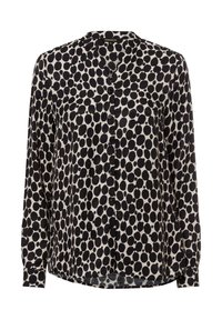 Schwarz-weißes Blusenshirt mit langen Ärmeln, das ein gepunktetes Muster, einen runden Kragen und eine einzelne Brusttasche aufweist. Glatte Stofftextur.