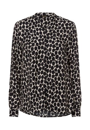Schwarz-weißes Blusenshirt mit langen Ärmeln, das ein gepunktetes Muster, einen runden Kragen und eine einzelne Brusttasche aufweist. Glatte Stofftextur.