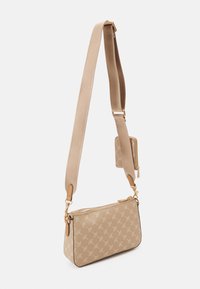 Beige crossbody bag with logo pattern, smooth texture, gold hardware, and an adjustable fabric strap. Includes a detachable zippered pouch.