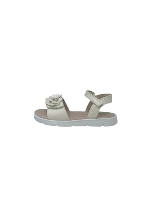 Sandalo beige per bambini con cinturino regolabile alla caviglia e fiore decorativo sulla fascia anteriore, con suola bianca flessibile.