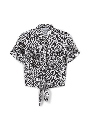 Camicetta corta a maniche corte in stampa zebra bianca e nera, con un dettaglio di legatura frontale e due tasche sul petto. Tessuto leggero.