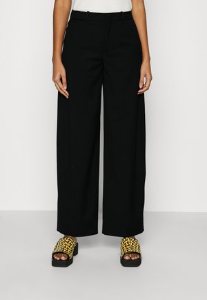 DESK - Trousers - black