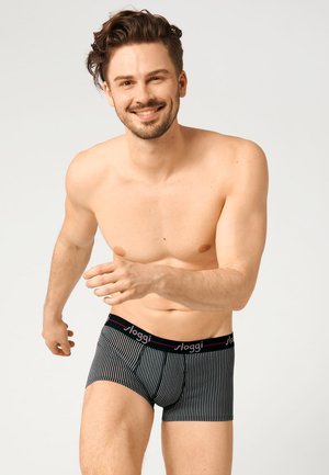 Zwart-wit gestreepte boxers met een elastische tailleband waarop het "sloggi"-logo in roze staat. Glad stof, slim-fit design.