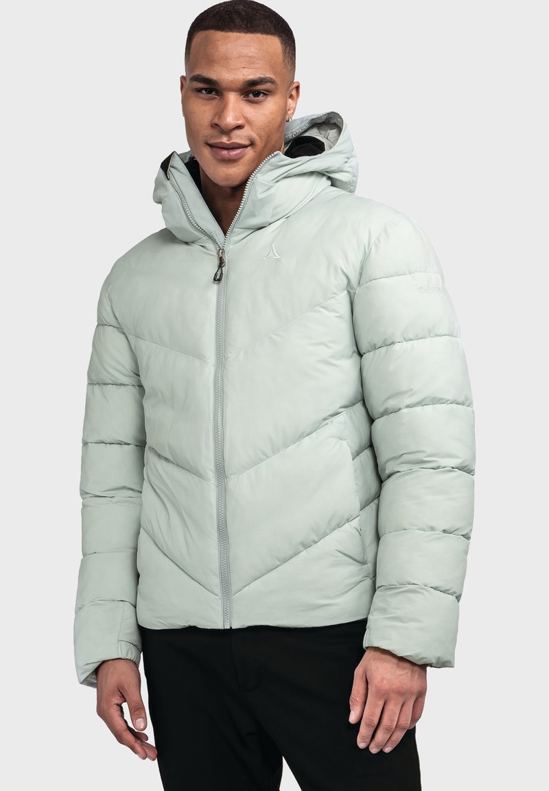 Hellegrüne Pufferjacke mit Kapuze, die mit einem Zickzack-gesteppten Muster, einem Reißverschluss und elastischen Bündchen für Wärme und Komfort ausgestattet ist.