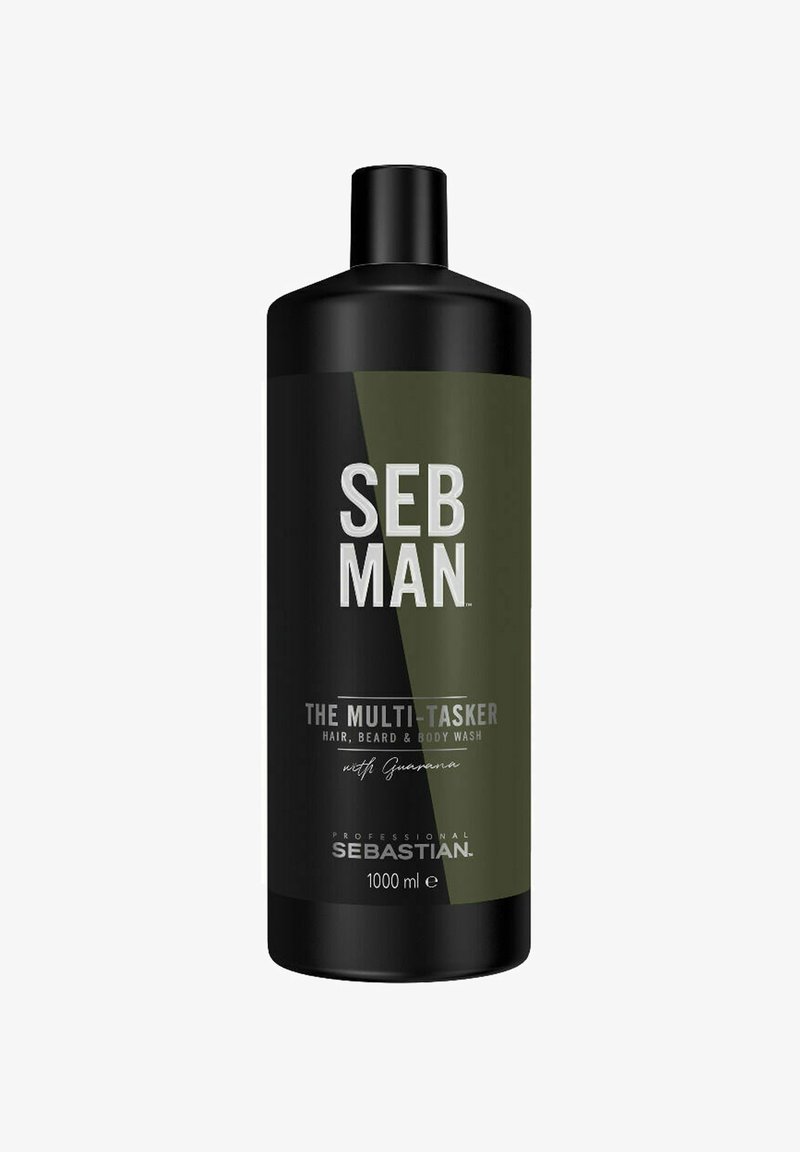 Zwarte cilindervormige fles met groene accenten, gelabeld "SEB MAN THE MULTI-TASKER," bevat 1000 ml haar-, baard- en lichaamswas.