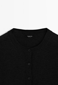 Black cardigan with a round neckline and five buttons, displaying the label "Massimo Dutti" stitched on the inside.