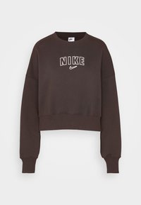 Ciemnobrązowy, krótki sweter z długimi rękawami, z prążkowanymi mankietami, z białym logo "NIKE" na środku przodu.